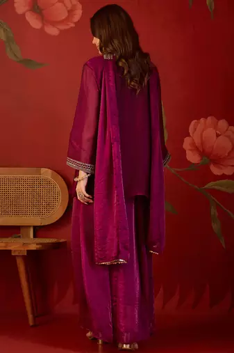 Rani tissue satin embroidered kurta sharara set with dupatta.