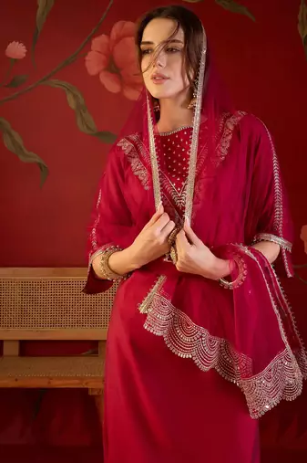 Rani silk blend embroidered kurta set with dupatta.