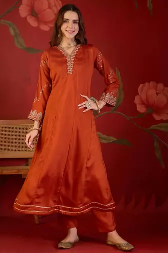 Orange silk blend embroidered anarkali kurta set with dupatta.