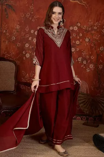 Maroon silk blend embroidered kurta sharara set with Dupatta.
