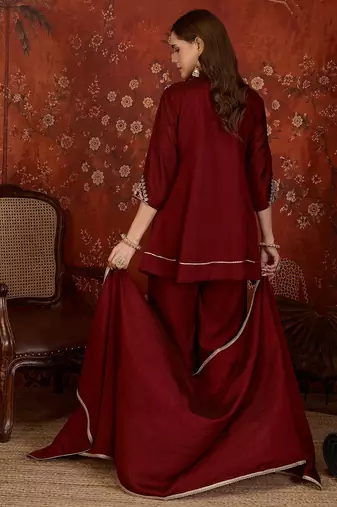 Maroon silk blend embroidered kurta sharara set with Dupatta.
