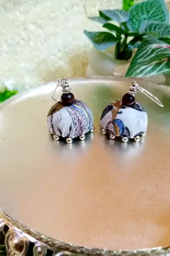 white fabric traditional jhumka earrings