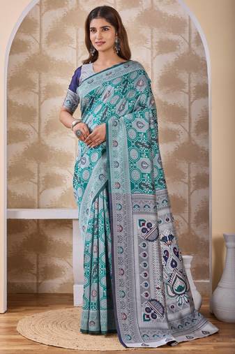 Rama green banarasi cotton silk kota saree with woven zari work, floral pallu and blouse