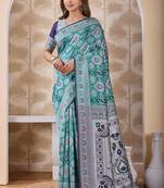 Rama green banarasi cotton silk kota saree with woven zari work, floral pallu and blouse