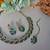 Green color yellow gold plating festive wear designer necklace set