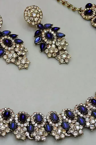 Beige color yellow gold plating festive wear designer necklace set