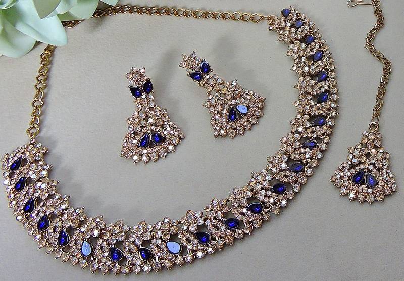 Beige color yellow gold plating festive wear designer necklace set