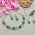 Green color yellow gold plating festive wear designer necklace set