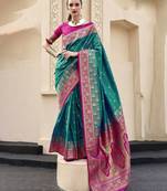 green ethnic motifs woven design zari banarasi saree