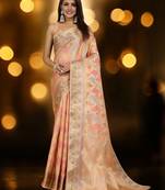 peach ethnic motifs woven design zari organza banarasi saree
