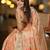 peach ethnic motifs woven design zari organza banarasi saree