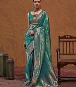 teal woven design zari silk blend kanjeevaram saree with matching blouse