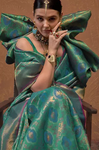 teal woven design zari silk blend kanjeevaram saree with matching blouse