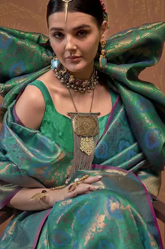 teal woven design zari silk blend kanjeevaram saree with matching blouse