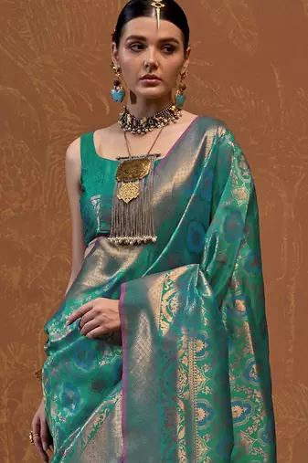 teal woven design zari silk blend kanjeevaram saree with matching blouse