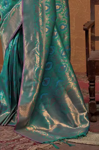 teal woven design zari silk blend kanjeevaram saree with matching blouse