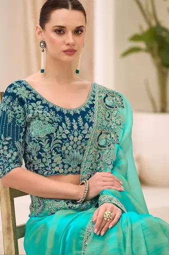 turquoise turquoise tissue ethnic embellished festive wear matching blouse sarees