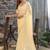 cream woven design embroidered satin saree