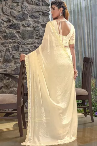 cream woven design embroidered satin saree