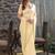 cream woven design embroidered satin saree