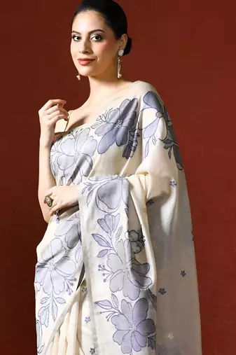 cream floral printed woven design saree