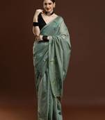 green woven design zari muga saree