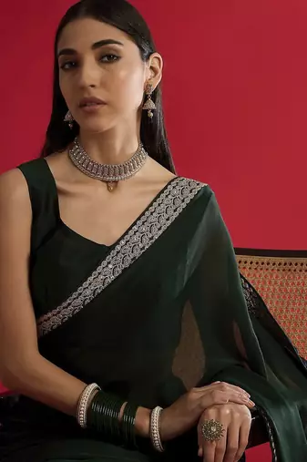 green sequinned satin saree