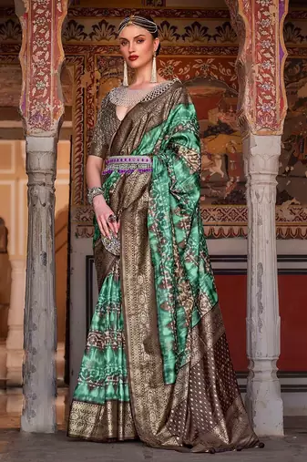 Lavender sea green sea green floral woven designed zari saree