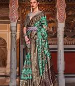 Lavender sea green sea green floral woven designed zari saree