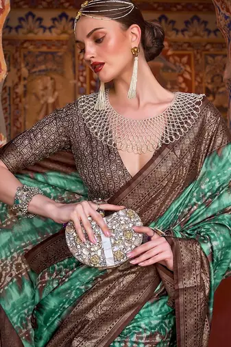 Lavender sea green sea green floral woven designed zari saree