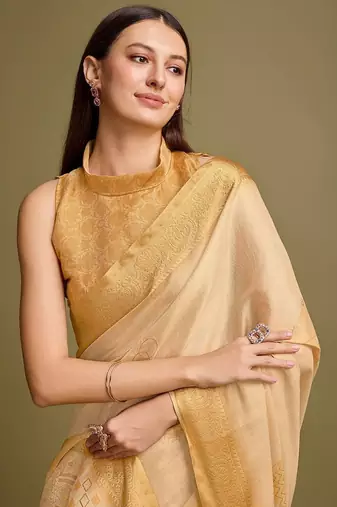 yellow zari woven embroidered tassel saree