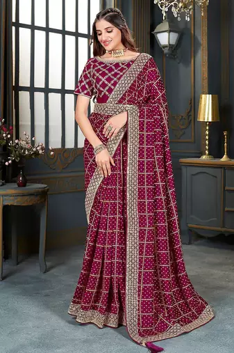 magenta bandhani embroidered silk blend saree