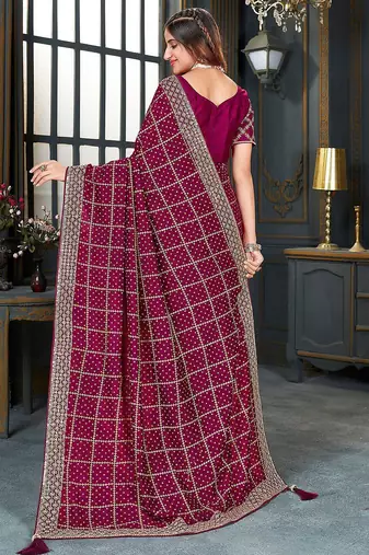 magenta bandhani embroidered silk blend saree