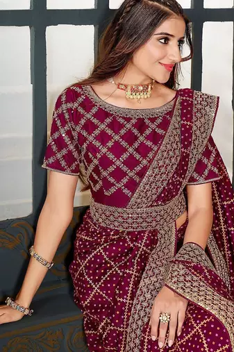 magenta bandhani embroidered silk blend saree