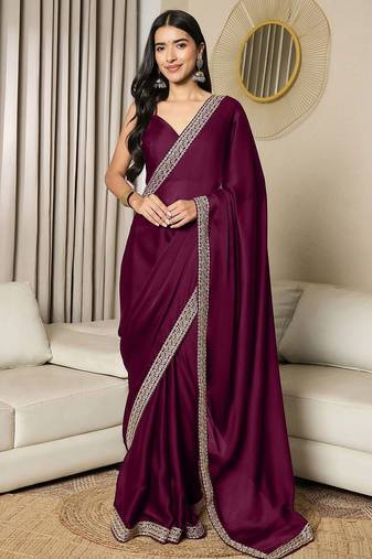 Green embroidered satin saree