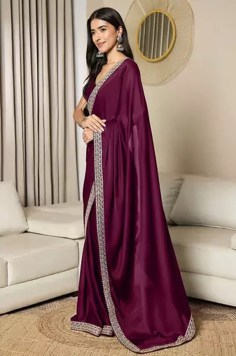Green embroidered satin saree