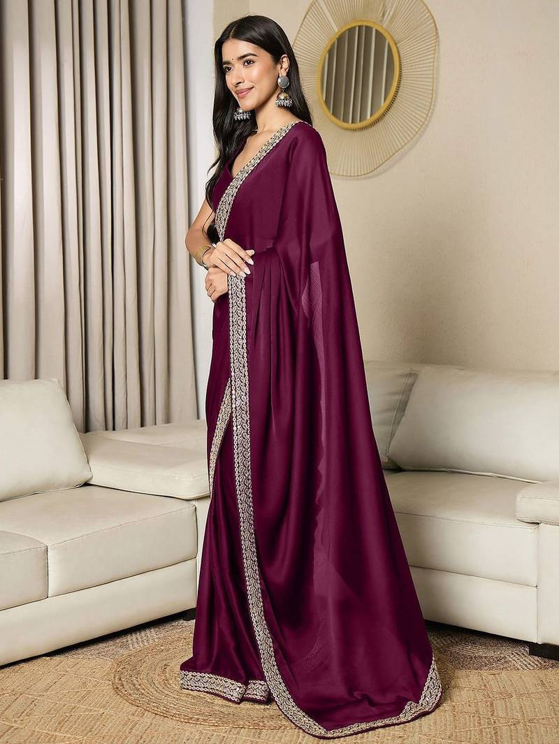 Green embroidered satin saree