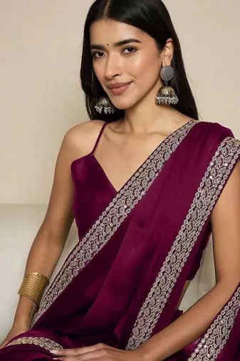 Green embroidered satin saree