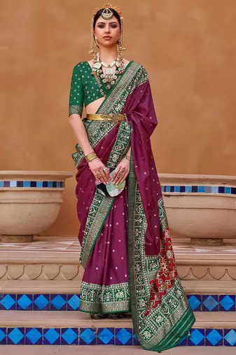 purple purple & green woven design zari silk blend saree