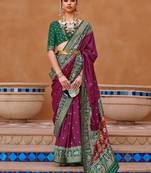 purple purple & green woven design zari silk blend saree
