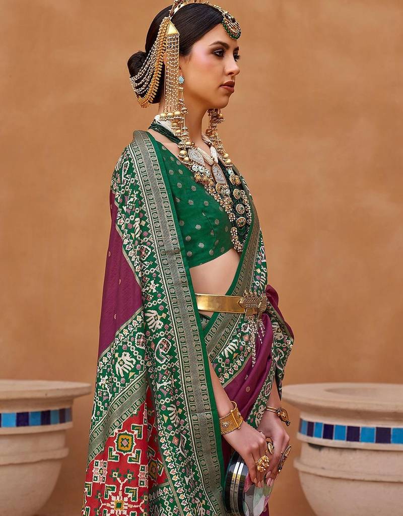 purple purple & green woven design zari silk blend saree