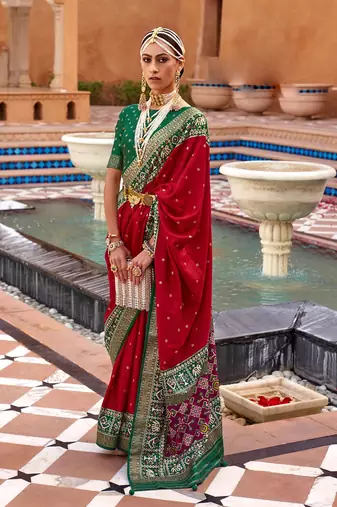 red red & green ethnic motifs woven design zari saree