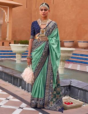 Sea green sea green & gold-toned ethnic motifs zari silk blend banarasi saree 1