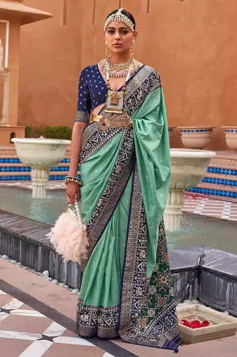 Sea green sea green & gold-toned ethnic motifs zari silk blend banarasi saree