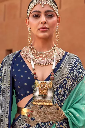 Sea green sea green & gold-toned ethnic motifs zari silk blend banarasi saree