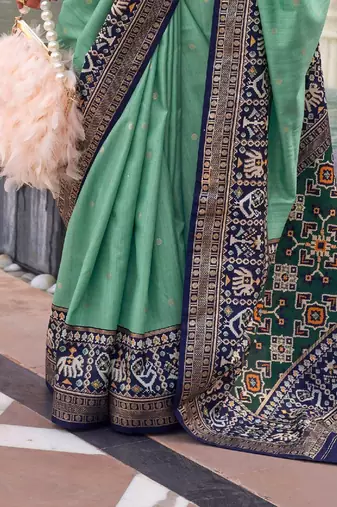 Sea green sea green & gold-toned ethnic motifs zari silk blend banarasi saree
