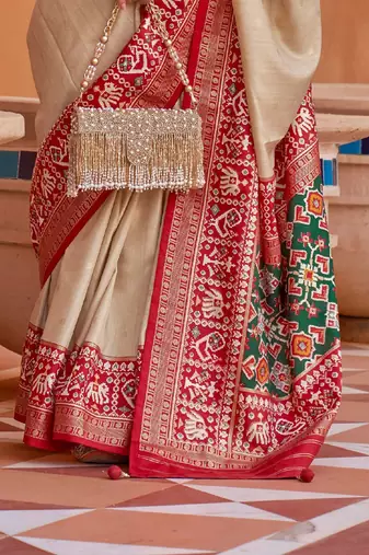 Green ethnic motifs printed silk blend saree