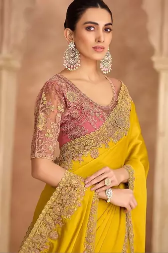 yellow embellished embroidered satin heavy work saree