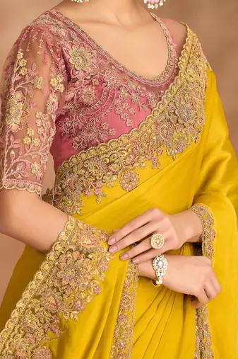 yellow embellished embroidered satin heavy work saree