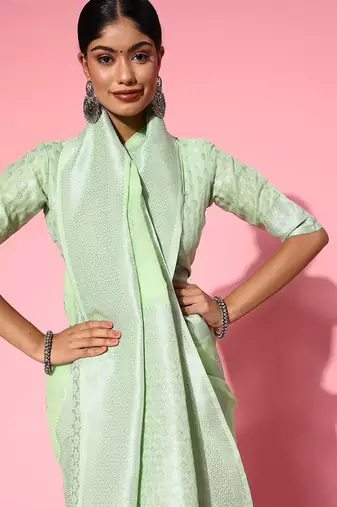 green floral saree with woven design border